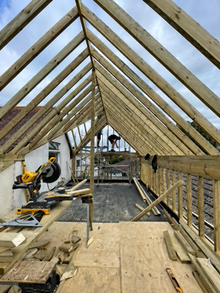 Exposed timber roof structure inside a property during construction